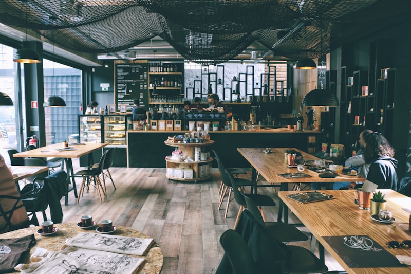 Cozy wooden café seating area with natural window light